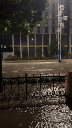 Heavy rain floods Tashkent streets, cars navigate deep water