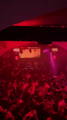 Crowded nightclub scene captured in Turin during late-night hours