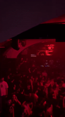 Crowded nightclub scene captured in Turin during late-night hours