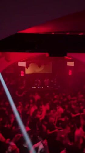Crowded nightclub scene captured in Turin during late-night hours