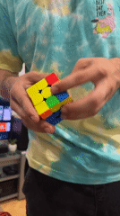 Person holds Rubik's Cube in SpongeBob shirt in Lovech