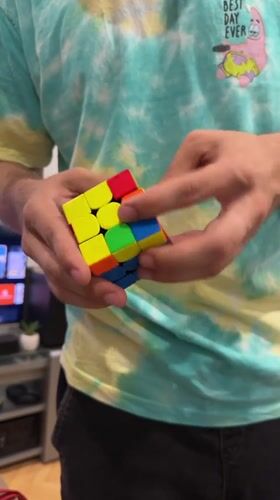 Person holds Rubik's Cube in SpongeBob shirt in Lovech