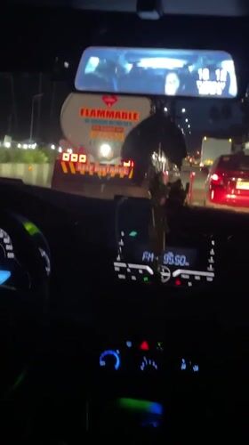 Driver records flammable tanker truck in nighttime Philippines traffic
