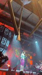 Colorfully Costumed Performer Spotted on Concert Stage