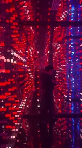 People gather in patriotic-lit room in Mexico City