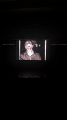Audience watches artistic video display in Vancouver auditorium