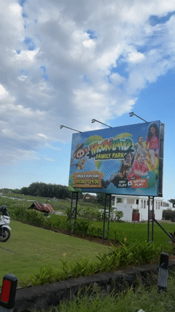 Rural rice paddies filmed near Mookiland Family Park billboard
