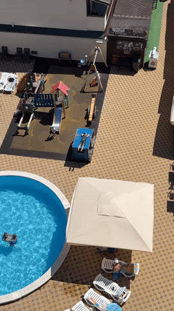 Woman enjoys beach day at Anapa resort complex