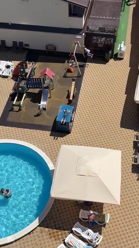 Woman enjoys beach day at Anapa resort complex
