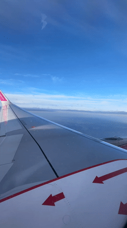 Passenger captures Wizz Air wing view over Dortmund