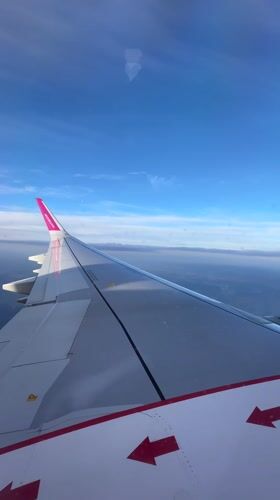 Passenger captures Wizz Air wing view over Dortmund