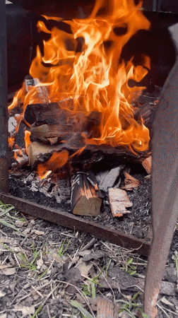 Outdoor cooking over wood fire observed in Russian village