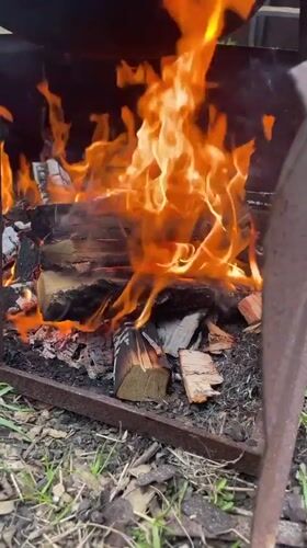 Outdoor cooking over wood fire observed in Russian village