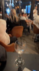 Restaurant gathering shows people celebrating in industrial-style venue