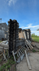 Abandoned log cabin documented in partial collapse, Russia