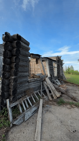Abandoned log cabin documented in partial collapse, Russia