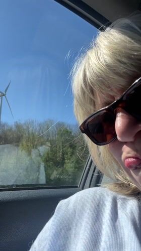 Woman travels by car through French countryside