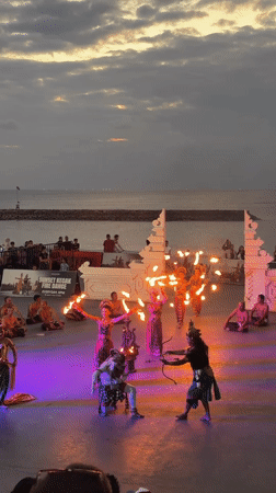 Kecak fire dancers perform at sunset on Kuta's beachfront stage
