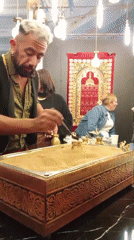 Man demonstrates traditional Turkish coffee preparation in Santiago