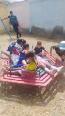 Kids' outdoor gathering and flooded streets in Juan Griego