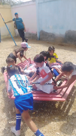 Kids' outdoor gathering and flooded streets in Juan Griego