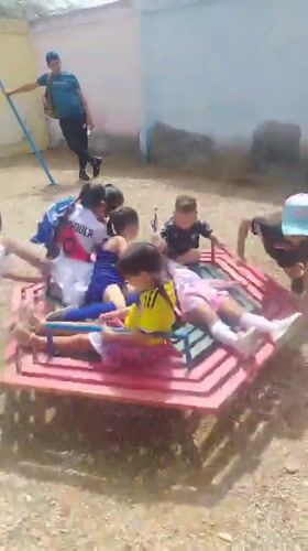 Kids' outdoor gathering and flooded streets in Juan Griego