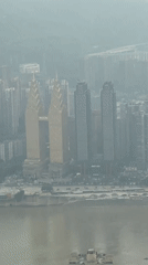 Morning in Chongqing's Yuzhong District, river views to retail streets