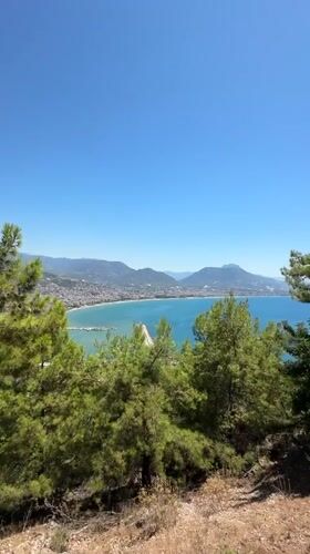 Hilltop views over Alanya's turquoise bay on a clear morning