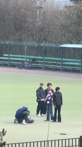 Young people gather on sports field in Staraya
