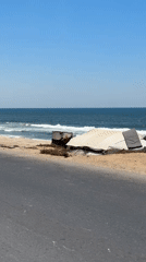 Damaged coastal area near Gaza shows debris and quiet shoreline