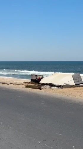 Damaged coastal area near Gaza shows debris and quiet shoreline
