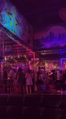 Nightlife scene captured at Đà Nẵng bar with colorful lighting