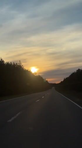Sunset captured over two-lane road in Kaduy, Russia