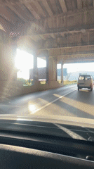 Driver passes under bridge in sunny Budva, Montenegro
