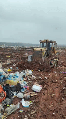 Bulldozer spotted at Russian garbage dump site