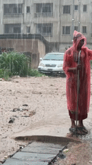 Heavy rains flood Nkpor streets, resident with broom observed