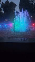 Colorful fountain light show at dusk in Burgas park