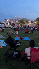 Cleveland outdoor evening event with stadium backdrop and bocce courts