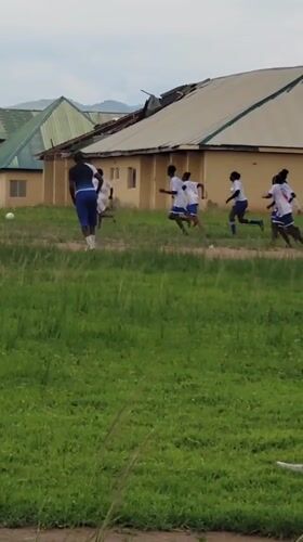 Children play soccer and dance on field in Zaga Nigeria