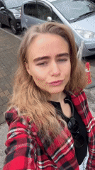 Woman documents urban walking tour with animals and cafes