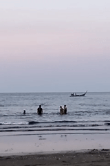 Peaceful beach scenes captured in Lhokseumawe, Indonesia at dusk