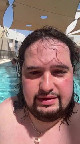 Man records poolside selfie video in Eilat resort area