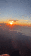 Airplane passenger films sunrise over Jembrana, Indonesia