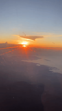 Airplane passenger films sunrise over Jembrana, Indonesia
