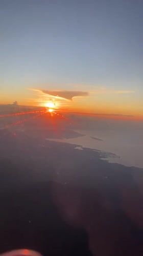 Airplane passenger films sunrise over Jembrana, Indonesia