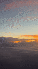 Aerial sunrise view captured above clouds in Cambodia
