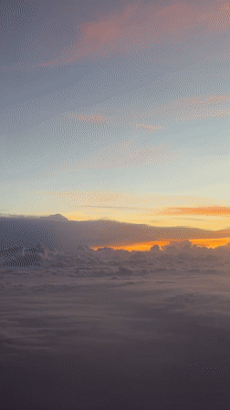 Aerial sunrise view captured above clouds in Cambodia