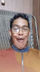 Goofing around for the camera in a Muaro Jambi room