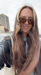 Woman walks in windy weather as choppy waters observed in Saratov