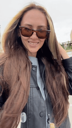Woman walks in windy weather as choppy waters observed in Saratov
